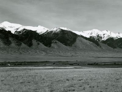 Black and white photograph of the San Luis Valley mountains with snow-capped peaks