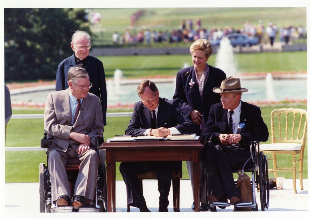 George H W Bush signs American Disability Act