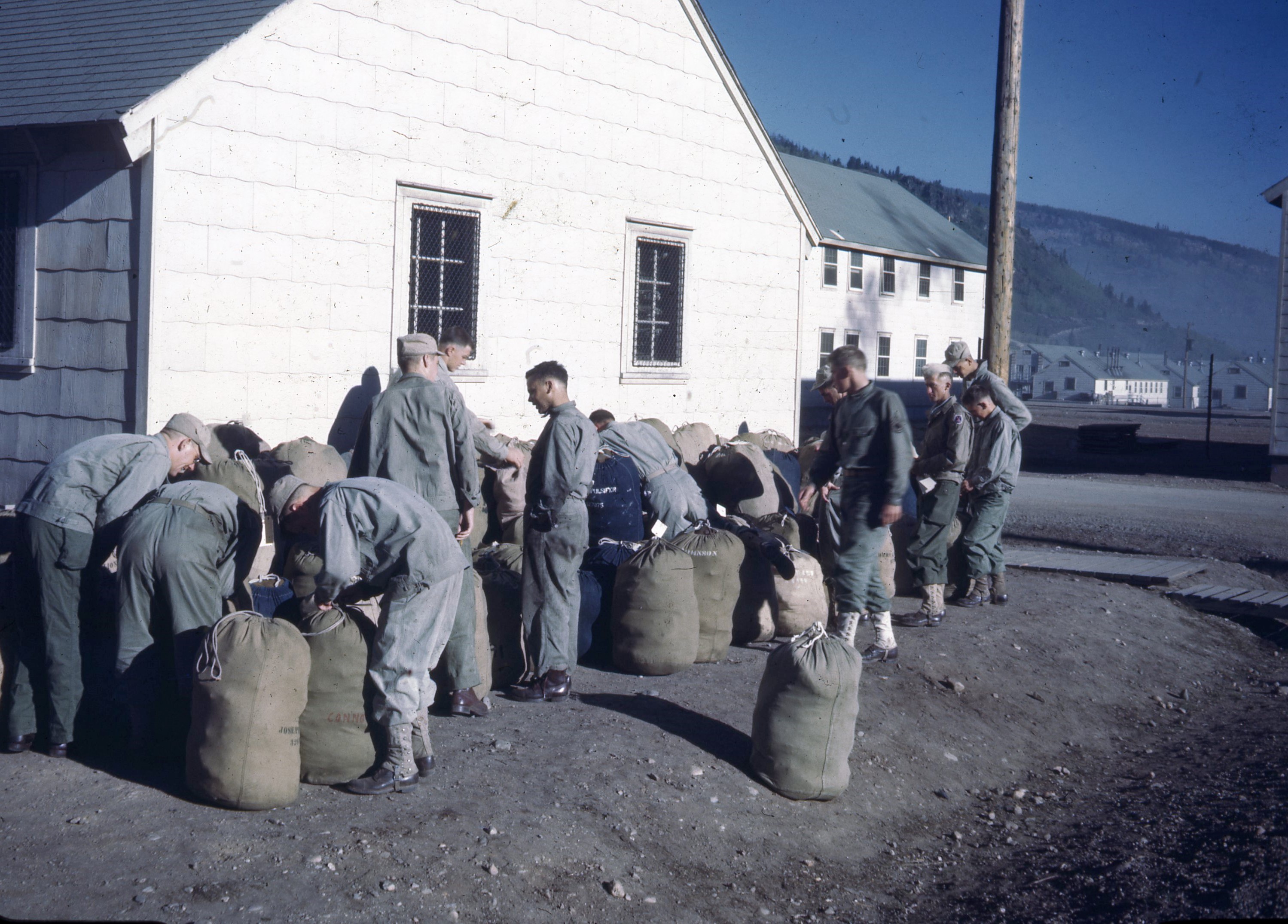 Soldiers pack their bags to leave Colorado for Camp Swift, Texas.
