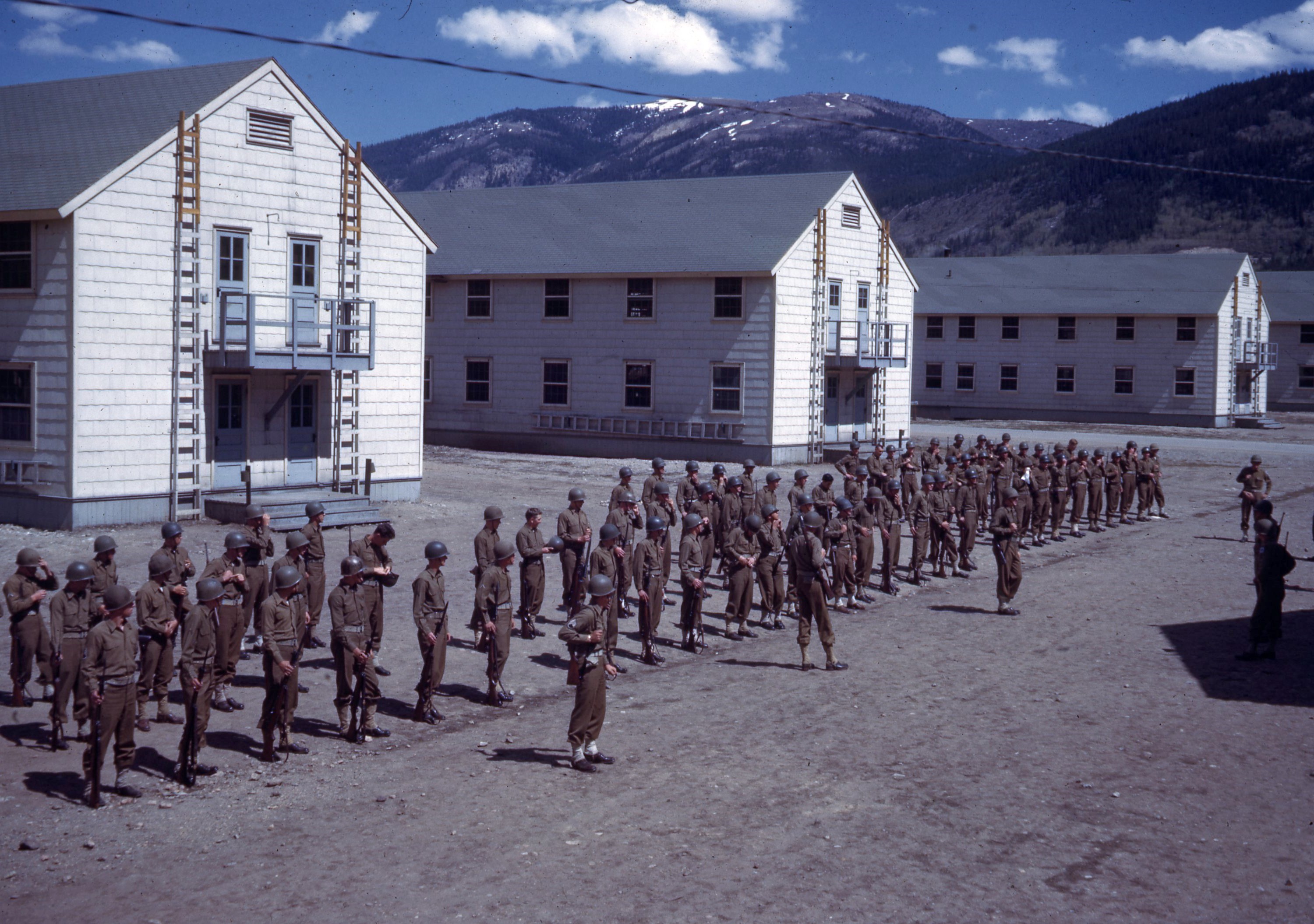 Soldiers assemble outside their barracks at Camp Hale, Colorado.