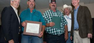 Members of the Mekelburg Farm receive their Centennial Farm award from Ed Nichols, John Salazar and John Hickenlooper.