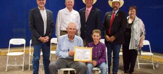 Noble family members (seated) with their Centennial Farm certificate.