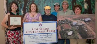 Wilson Farm family with their award.