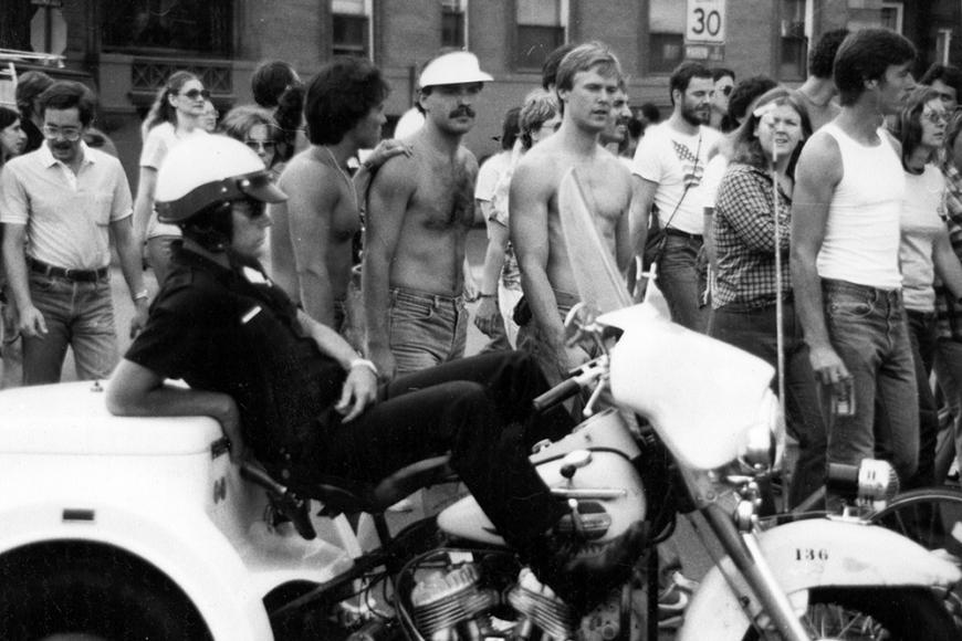 Gay and Lesbian Community Center of Colorado Collection photo of policeman and parade attendees at Gay Pride March in 1981