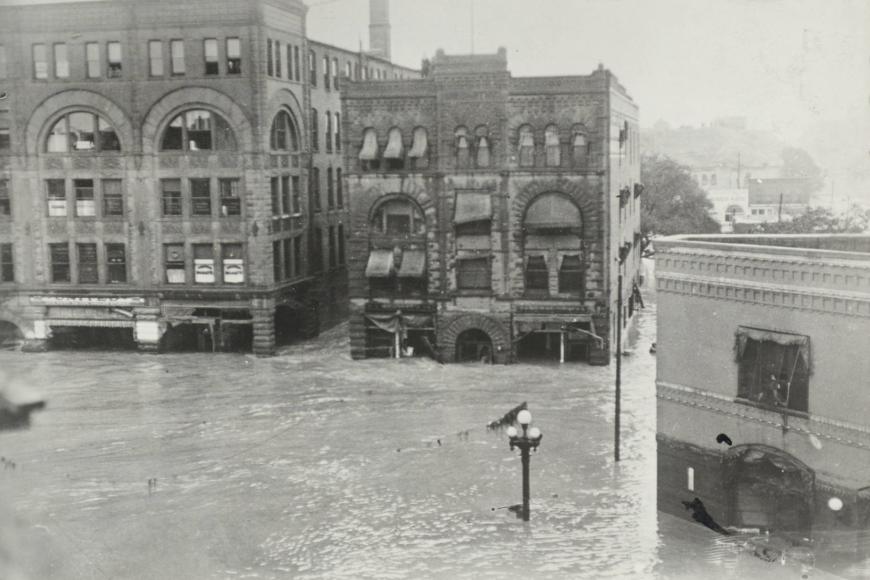 Water more than two stories high on historic buildings from 1921.