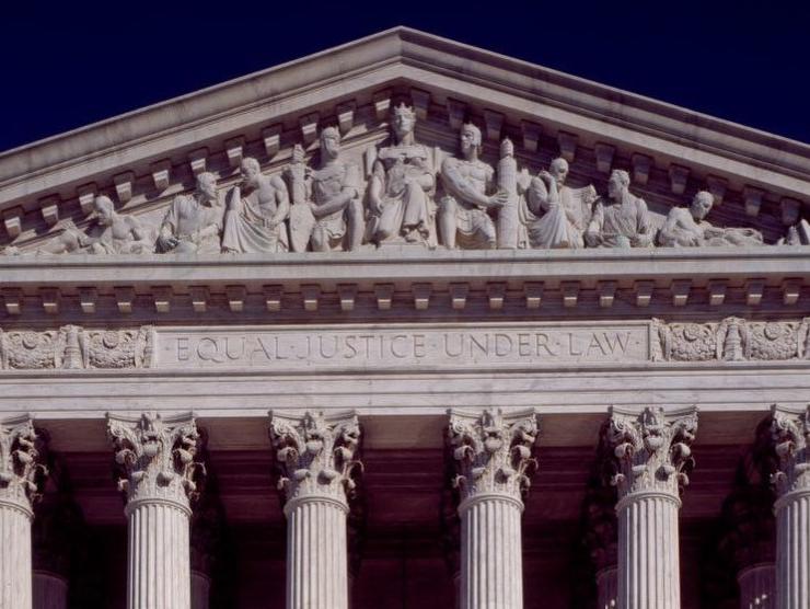 Detail of West Pediment of Supreme Court Building. The nine figures featured are Liberty Enthroned in the center, with Order on her right and Authority on her left. Council, with Research (past and present) are also visible, as are the words. "Equal Justice Under Law."