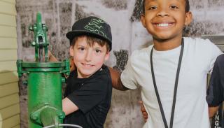 Kids pumping water